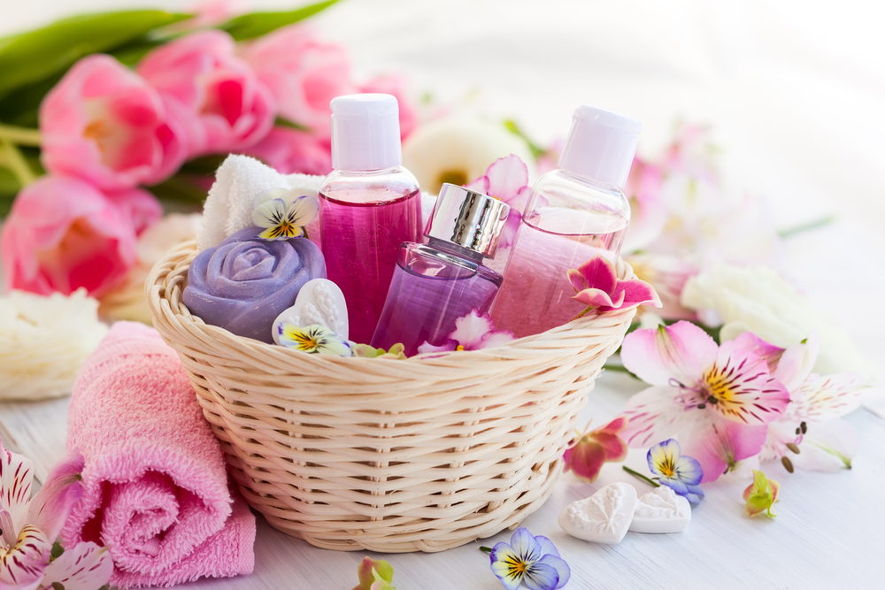 A gift basket with soaps and perfumes.